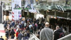 Photo: Visitors in the entrance area of REHACARE 2018; Copyright: Messe Duesseldorf/ctillmann