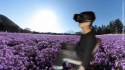 Image: Virtual reality background with a wheelchair user wearing virtual reality glasses; Copyright: TOYOHASHI UNIVERSITY OF TECHNOLOGY